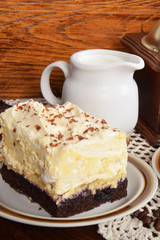 black coffee in a cup with chocolate cake