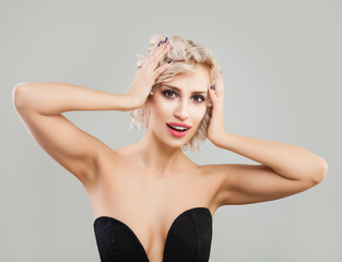 Perfect Blonde Woman with Curly Bob Hairstyle and Makeup on Background