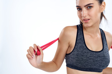 sports girl with ropes close-up