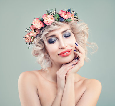 Blonde Beauty. Perfect Woman Fashion Model with Bright Makeup, Spring Flowers and Blonde Bob Haircut