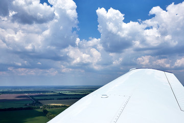 Fototapeta na wymiar View from the plane window at low altitude.