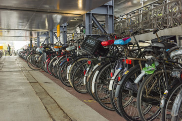 AMSTERDAM, NETHERLANDS - SEPTEMBER 24, 2017: Parking of bicycles in Amsterdam city. Amsterdam, Netherlands..