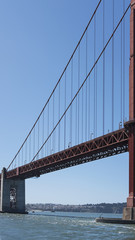 Vertical section of the suspension and cropped view of south tower of the iconic Golden Gate Bridge, San Francisco, California, USA