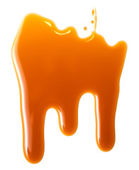 Sweet caramel sauce isolated on white background close up. Golden Butterscotch toffee caramel liquid .