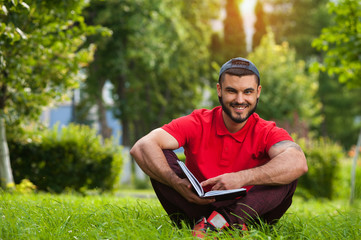 Charming young man posing on nature