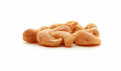 Cashew nuts heap on white background