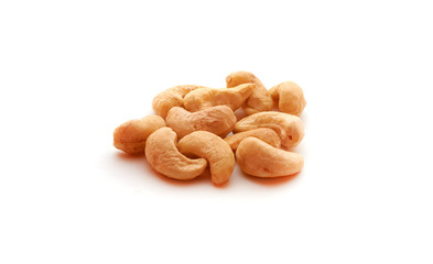 Cashew nuts heap on white background