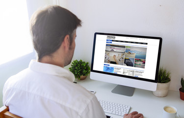 man surfing internet on computer