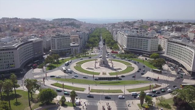 sunny day lisbon city marquess of pombal square aerial park panorama 4k portugal

