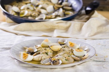 Hake with clams and eggs