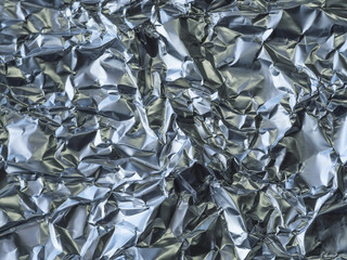 close up crumpled aluminium tinfoil silver background