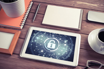 Web security and technology concept with tablet pc on wooden tab