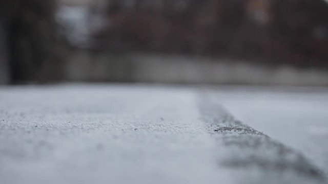 Cloes Up Snow on Pavement