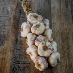 Garlic Cloves and Garlic Bulb on vintage wood background
