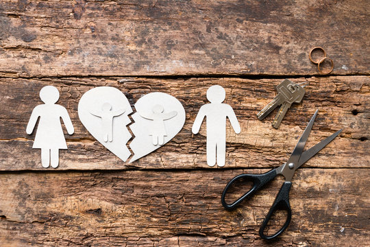 divorced couple and children near a broken heart