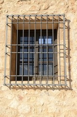 Fototapeta na wymiar Iron bars on window in Belmonte, Cuenca, Spain
