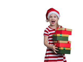 Happy child with a mountain of gifts. Emotional portrait. Delight girls in Christmas hat
