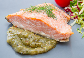 salmon fillet with sauce and mixed salad