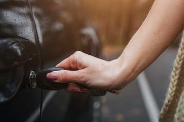 Woman holding car keys. Close up Hand