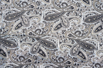 Gray background with ornament texture of clothes.