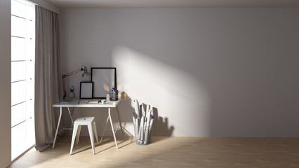 Small desk with blank pictures in spacious room