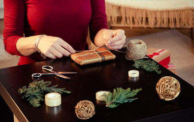 woman wrapping christmas presents