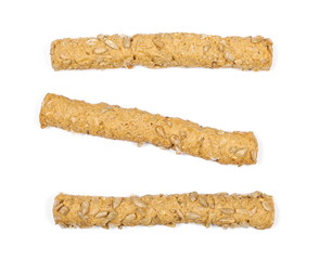 Integral bread sticks with sunflower seeds isolated on white background, top view