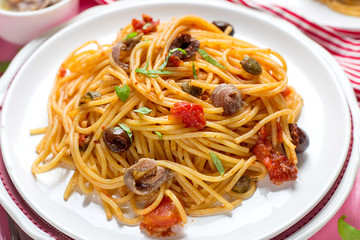 Pasta with tomatoes, olives, capers and anchovies Spaghetti alla puttanesca