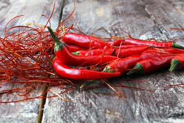 extra hot red chili pepper strings, threads on white background.