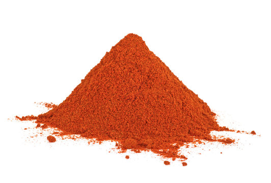 Pile of red paprika on a white background