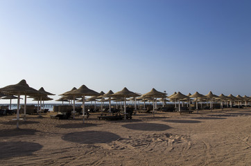 Sun umbrellas on the sea beach