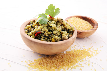 Bowl with homemade Bulgur Salad with parsley.