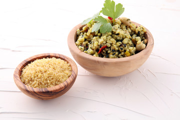 Bowl with homemade Bulgur Salad with parsley.