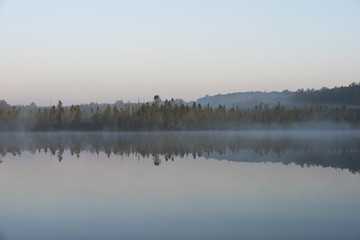 Morning fog on a Quiet Lake