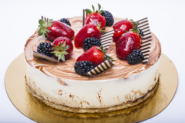 Fresh berry cake on a white background.