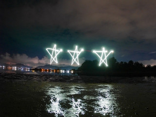star , made from sparkle  light paining in the dark night , motion with long exposure .