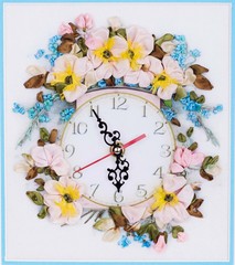 Handmade wall clock decorated with flowers