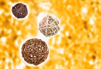 Decorative Christmas balls on a golden shiny background stock photo images. Glossy yellow background. Abstract yellow background. Elegant holiday background. Golden christmas decorations