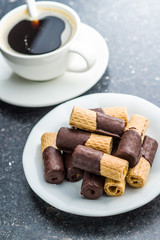 Sweet dessert. Biscuits rolls with chocolate.