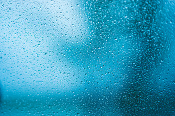 Autumn rain on the car glass