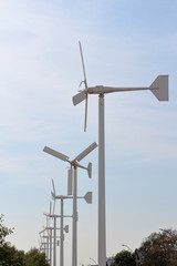 White Wind Turbines for Sustainable Power Generation and Environmentally Friendly Blue Sky and White Clouds