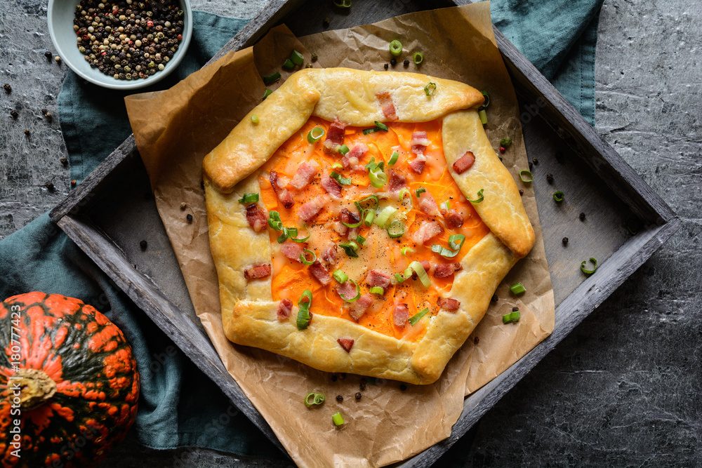 Wall mural pumpkin galette with bacon, cheese and green onion