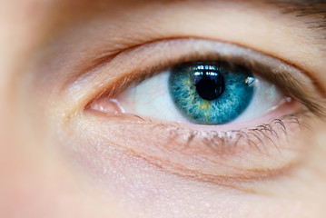 blue one eye male close-up pupil view