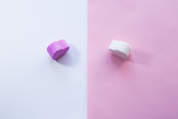 White and pirple candies in shape of heart