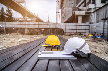 The safety helmet on construction site with Steel tube background