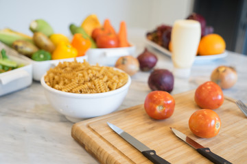 Cooking in the kitchen , preparation fresh vegetables and ingredients for macaroni on a table