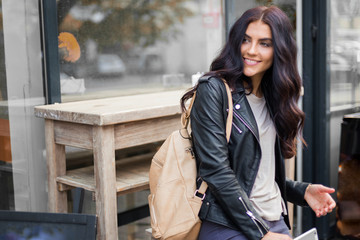 Young pretty spanish woman in cafe in city centre