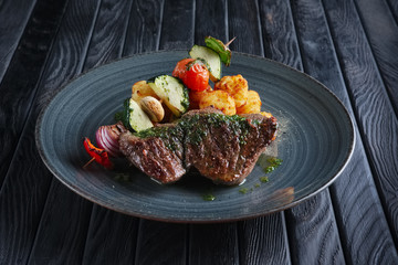 Juicy grilled beef fillet with potato, mushroom, zucchini, tomato, pepper and red onion on wooden skewer