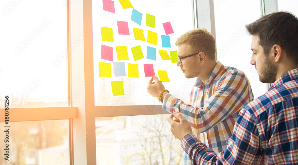 Poster web designer working on the best framework of a new application