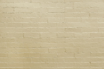 Old beige brick wall background texture